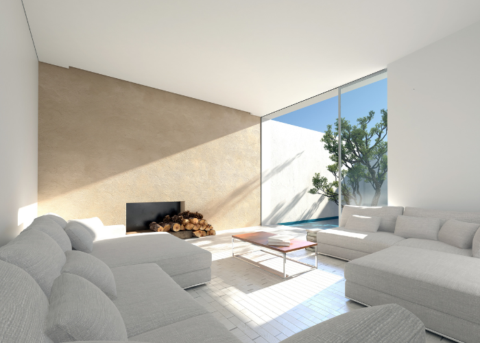 salotto esterno con divano in lino e pareti bianche